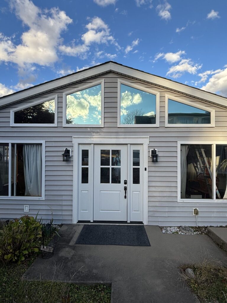 Exterior view of a home with energy-efficient window tinting installed by MINT Window Tint in Pittsburgh, PA